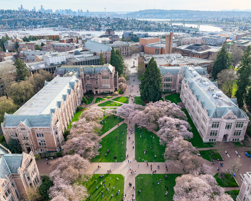 Aerial view of the University of Washington campus Quad with the city of Seattle in the distance