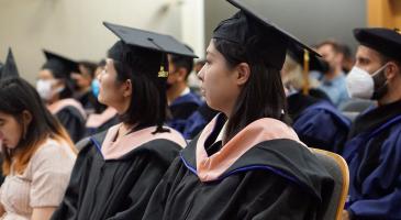 Two student graduates in MS Capstone Program attending 2022 graduation event
