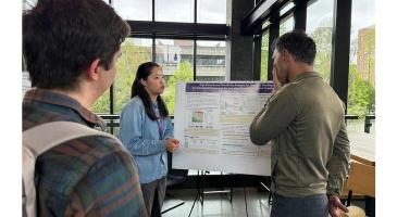 Yifan Lin and Ali Shojaie discuss Lin's research poster