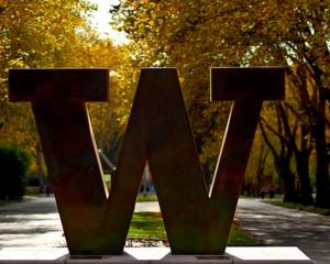 Photo of Bronze W at entrance to UW Campus