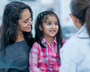 Mother and daughter meet with family doctor