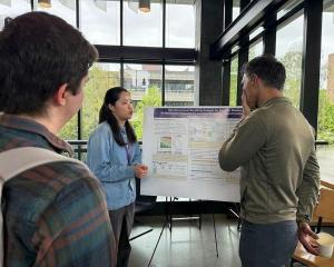 Yifan Lin and Ali Shojaie discuss Lin's research poster