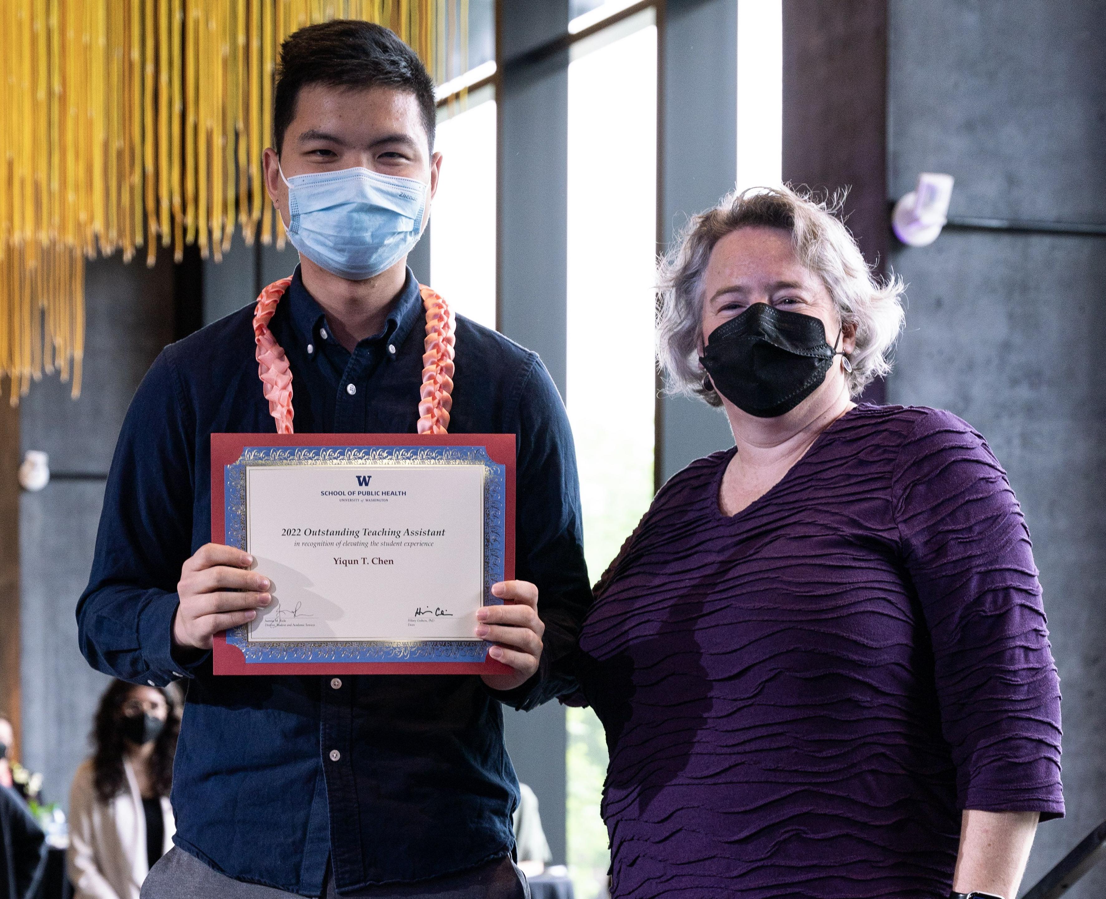 Yiqun Chen receives award certificate from SPH Dean Hillary Godwin